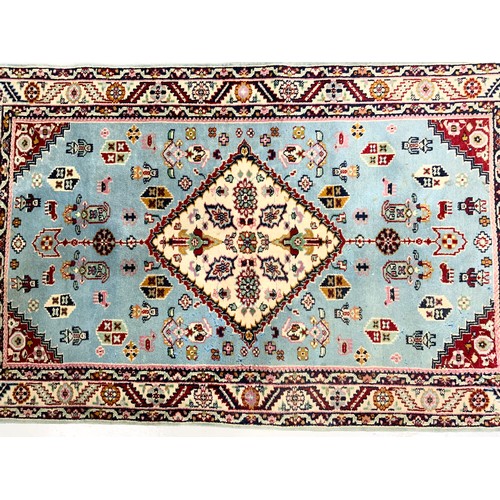 688 - INDIAN HAND WOVEN BLUE GROUND RUG 150cm x 90cm