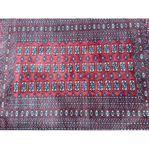 686 - RED GROUND RUG 180cm x 130cm