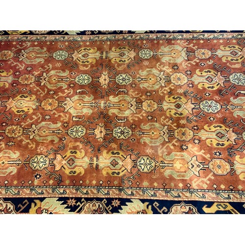 681 - INDIAN RED GROUND RUG 294cm x 192cm