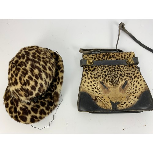 193 - TWO CHEETAH SKINS, A CHEETAH SKIN HANDBAG AND A HAT A/F