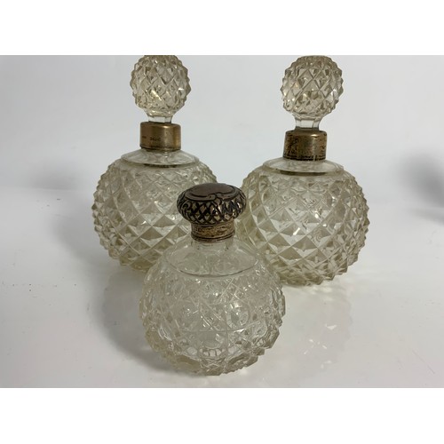 252 - COLLECTION OF SILVER TOP AND MOUNTED CUT GLASS AND OTHER DRESSING TABLE BOTTLES