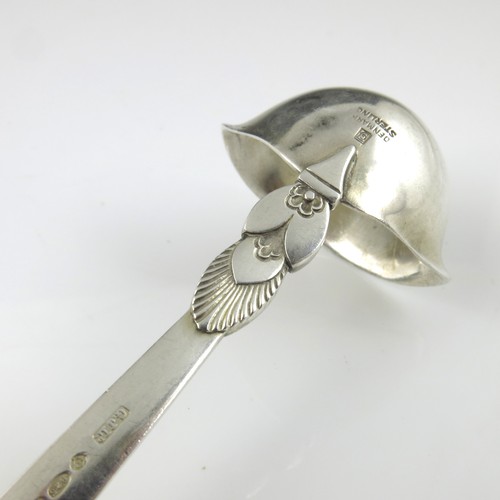 262 - DESIGNED BY GUNDORPH ALBERTUS FOR GEORG JENSEN, A DANISH SILVER CACTUS PATTERN SAUCE LADLE, APPROX. ... 