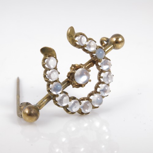 502 - HORSESHOE SHAPED BROOCH SET WITH MOONSTONES AND ONE OTHER MOONSTONE BROOCH AF