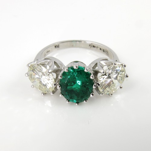 637 - AN IMPRESSIVE DIAMOND AND EMERALD RING FEATURING AN OVAL EMERALD OF APPROXIMATELY 1.96CT OF PARTICUL... 