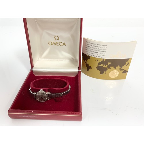 448 - LADIES OMEGA WRIST WATCH WITH BOX AND PAPERS