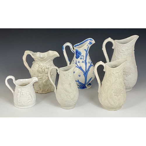 188 - MISCELLANEOUS RELIEF DECORATED JUGS (6)