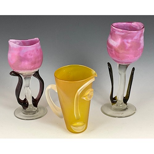 254 - PAIR OF STYLISED FLOWER VASES AND A MODERN STYLISED FACE GLASS JUG