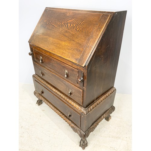 628 - CARVED OAK BUREAU ON BALL & CLAW FEET  103cm TALL