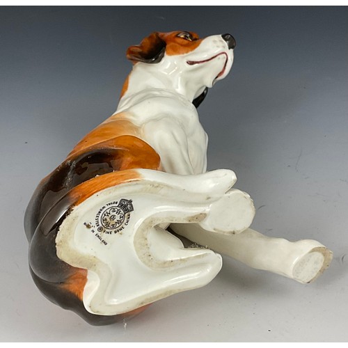 94 - ROYAL WORCESTER SEATED HOUND, approx. 18 cm