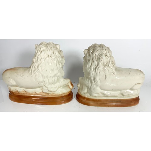 103 - PAIR OF STAFFORDSHIRE STYLE LION FIGURES 25cm TALL