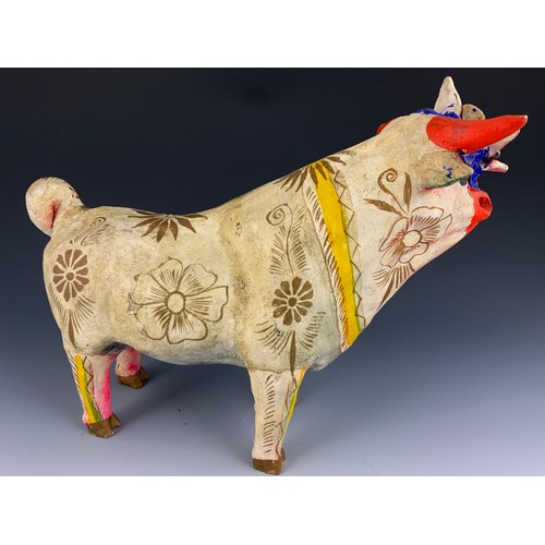 111 - UNUSUAL HAND MODELLED AND PAINTED STUDY OF A COW 40cm LONG