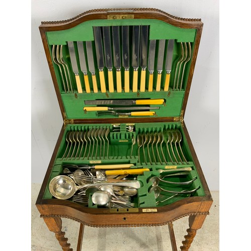 395 - PART  WALKER & HALL CANTEEN OF CUTLERY ON OAK STAND WITH BARLEY TWIST LEGS