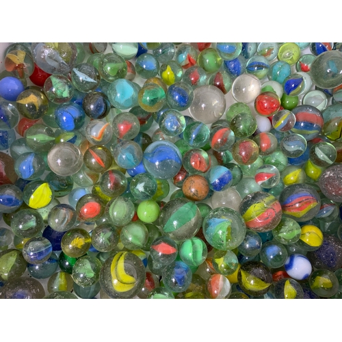 62 - BOX OF ASSORTED MARBLES