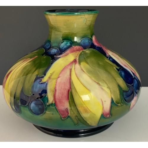 35 - MOORCROFT LEAF AND BERRY ON DARK BLUE GROUND SQUAT VASE, APPROX. 12 cm high, OLD MARK