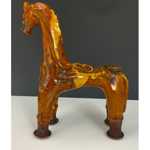 57 - A TURKISH POTTERY MODEL OF A HORSE, APPROX. 24 cm high