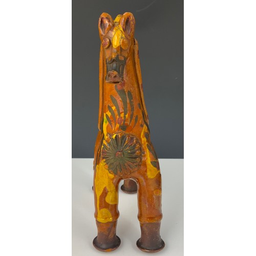 57 - A TURKISH POTTERY MODEL OF A HORSE, APPROX. 24 cm high