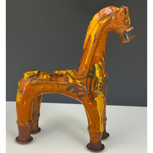 57 - A TURKISH POTTERY MODEL OF A HORSE, APPROX. 24 cm high