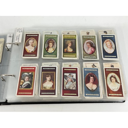 118 - A CIGARETTE CARD ALBUM CONTAINING 26 SETS OF ORIGINAL CARDS, MOSTLY G/VG, CATALOGUE £490+