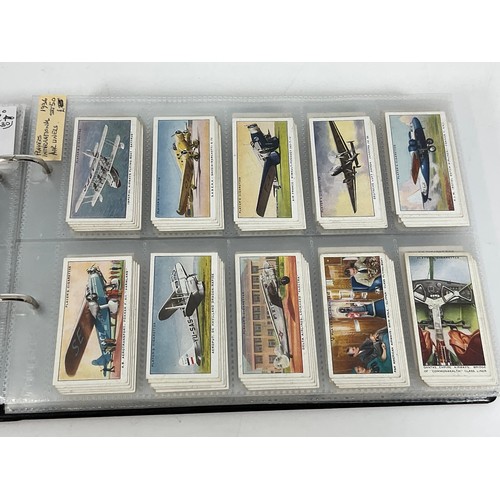 118 - A CIGARETTE CARD ALBUM CONTAINING 26 SETS OF ORIGINAL CARDS, MOSTLY G/VG, CATALOGUE £490+