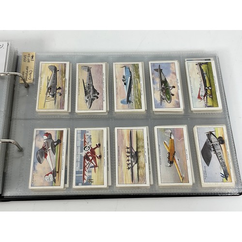 118 - A CIGARETTE CARD ALBUM CONTAINING 26 SETS OF ORIGINAL CARDS, MOSTLY G/VG, CATALOGUE £490+