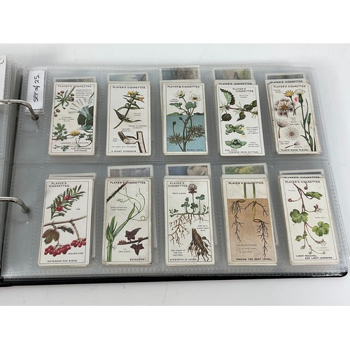 118 - A CIGARETTE CARD ALBUM CONTAINING 26 SETS OF ORIGINAL CARDS, MOSTLY G/VG, CATALOGUE £490+