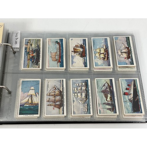 118 - A CIGARETTE CARD ALBUM CONTAINING 26 SETS OF ORIGINAL CARDS, MOSTLY G/VG, CATALOGUE £490+