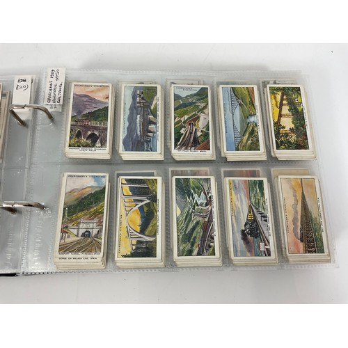 119 - A CIGARETTE CARD ALBUM CONTAINING 26 SETS OF ORIGINAL CARDS, MOSTLY G/VG, CATALOGUE £490+