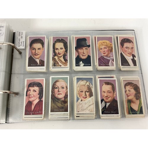 119 - A CIGARETTE CARD ALBUM CONTAINING 26 SETS OF ORIGINAL CARDS, MOSTLY G/VG, CATALOGUE £490+