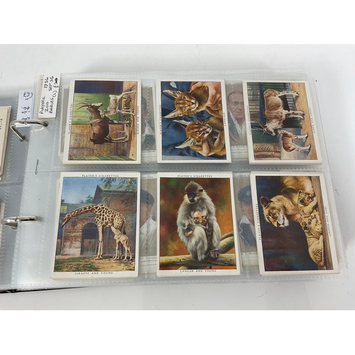 121 - A CIGARETTE CARD ALBUM CONTAINING 25 SETS OF ORIGINAL CARDS, MOSTLY G/VG, CATALOGUE £510+