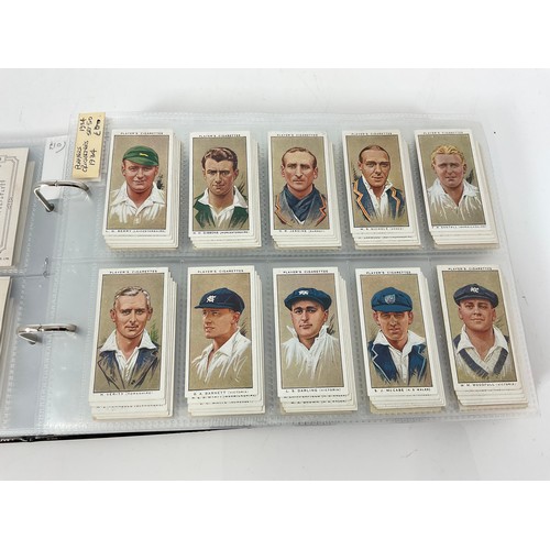 121 - A CIGARETTE CARD ALBUM CONTAINING 25 SETS OF ORIGINAL CARDS, MOSTLY G/VG, CATALOGUE £510+