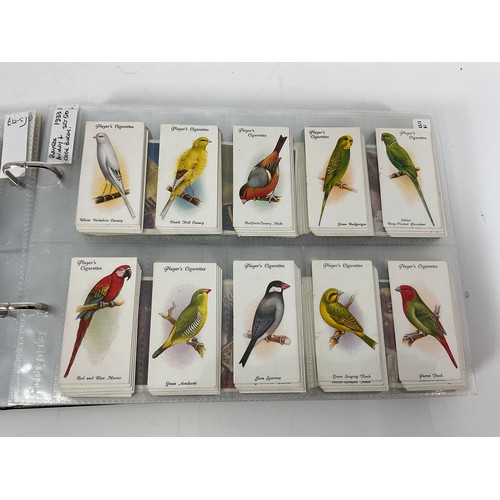 121 - A CIGARETTE CARD ALBUM CONTAINING 25 SETS OF ORIGINAL CARDS, MOSTLY G/VG, CATALOGUE £510+