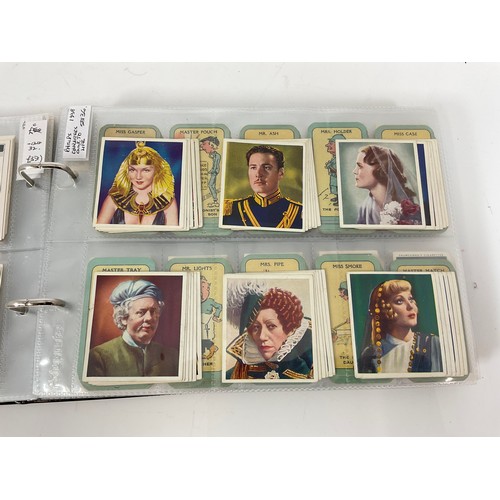 121 - A CIGARETTE CARD ALBUM CONTAINING 25 SETS OF ORIGINAL CARDS, MOSTLY G/VG, CATALOGUE £510+