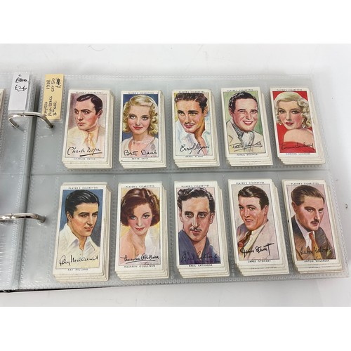 121 - A CIGARETTE CARD ALBUM CONTAINING 25 SETS OF ORIGINAL CARDS, MOSTLY G/VG, CATALOGUE £510+