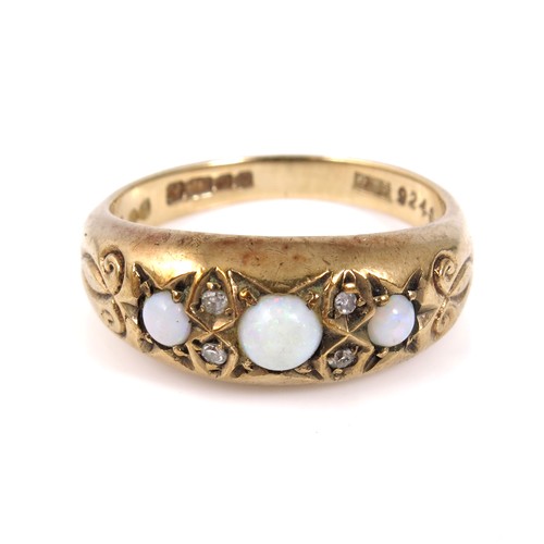 633 - 18CT GOLD RING SET WITH 3 OPALS EACH SEPARATED BY 2 SMALL DIAMONDS