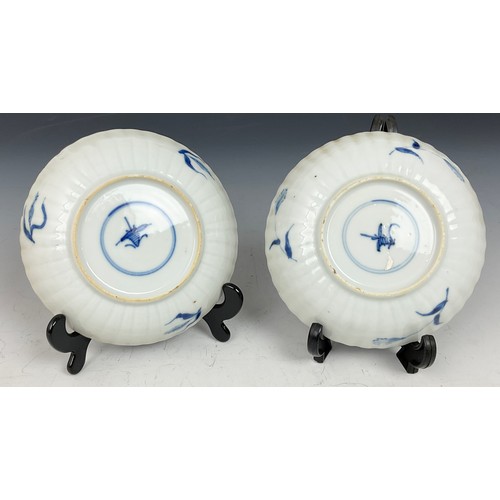 207 - 2 ORIENTAL BLUE AND WHITE DECORATED SAUCER DISHES, APPROX. 11.5 cm dia.