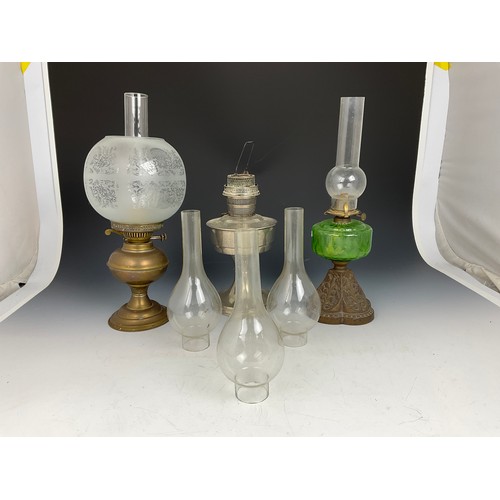 284 - 3 OIL LAMPS, ONE WITH GREEN GLASS BODY, ONE ETCHED GLASS AND ONE OTHER