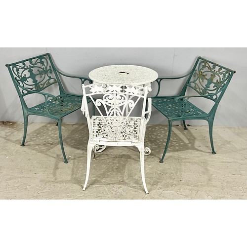 484 - PAIR OF CAST IRON GARDEN CHAIRS TOGETHER WITH ONE OTHER AND A TABLE