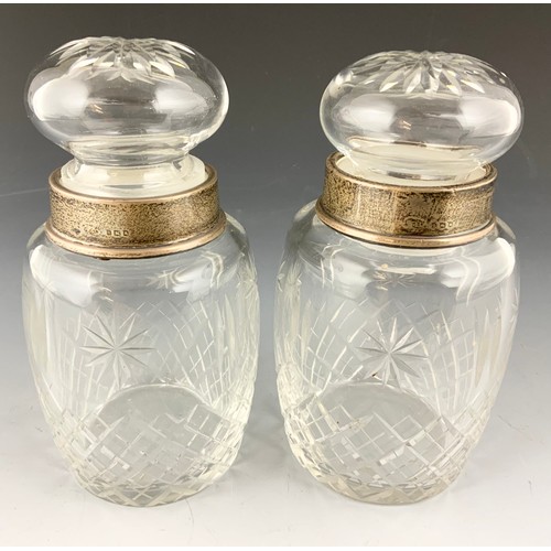 216 - PAIR OF GLASS JARS / BOTTLES WITH HALLMARKED SILVER COLLARS