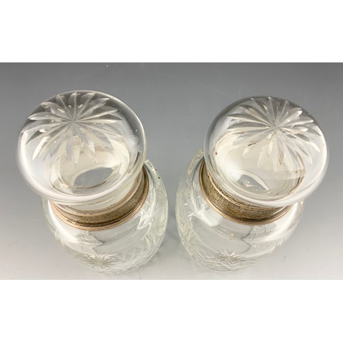 216 - PAIR OF GLASS JARS / BOTTLES WITH HALLMARKED SILVER COLLARS