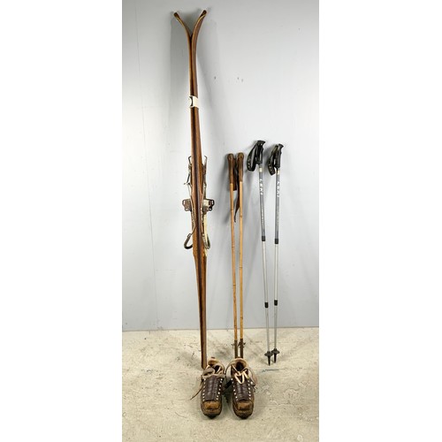 407 - VINTAGE SNOW SKIS AND BOOTS TOGETHER WITH A PAIR OF WALKING POLES