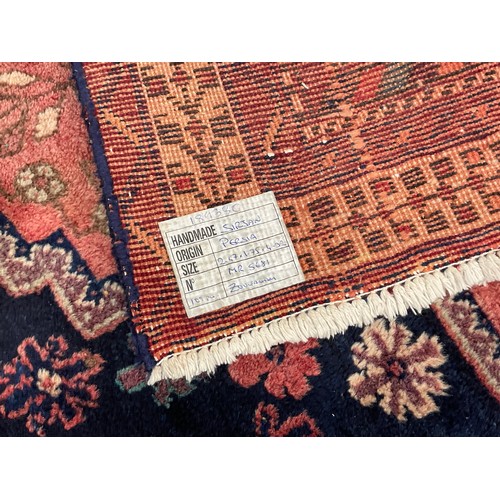 717 - PERSIAN RED GROUND CARPET, approx. 245 x 175 cm