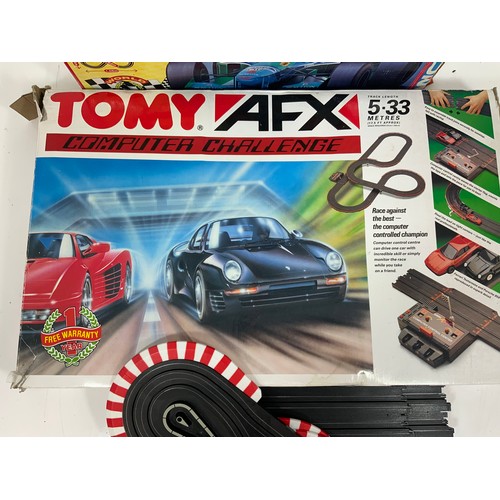 54 - MICRO SCALEXTRIC SET ‘WORLD CHAMPIONSHIP’ & TOMY AFX COMPUTER CHALLENGE SET. Contents not checked