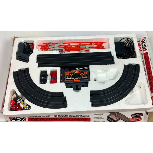 54 - MICRO SCALEXTRIC SET ‘WORLD CHAMPIONSHIP’ & TOMY AFX COMPUTER CHALLENGE SET. Contents not checked