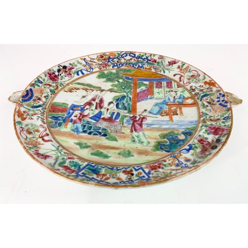 213 - UNUSUAL ORIENTAL  WARMING PLATE DECORATED WITH A COURT YARD SCENE