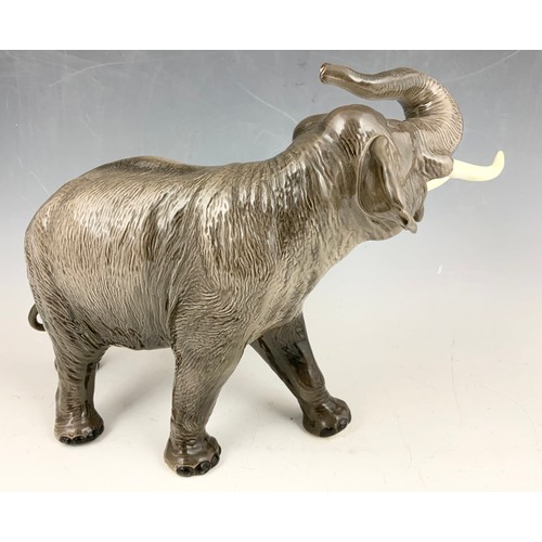 131 - LARGE BESWICK ELEPHANT WITH TRUNK IN SALUTE MODEL 1770 30cm TALL