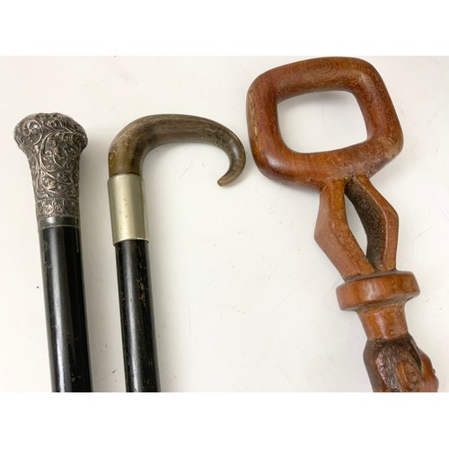 437 - WALKING STICK WITH SILVER TOP, 1 OTHER WITH A HORN HANDLE AND AN AFRICAN STICK