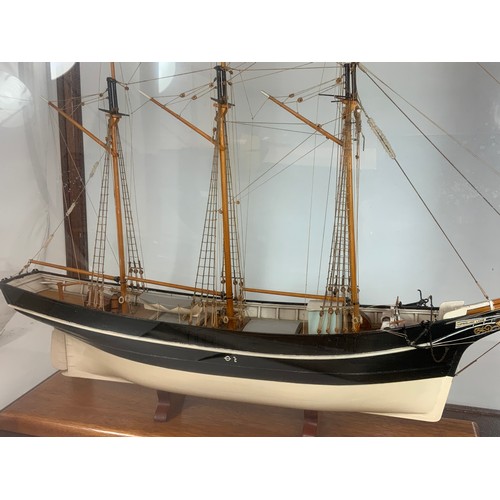 89 - MODEL OF SAILING SHIP / BRIGANTINE, ‘CUMBERLAND LASSIE’ APPROX. 77 CM LONG IN A GLAZED DISPLAY CASE.