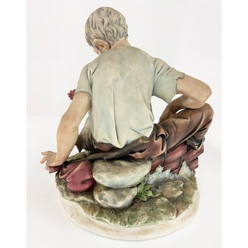 96 - 2 LARGE CAPODIMONTE FIGURINES  TRAMP ON BENCH &  MAN FRYING ON OPEN FIRE TALLEST 24cm