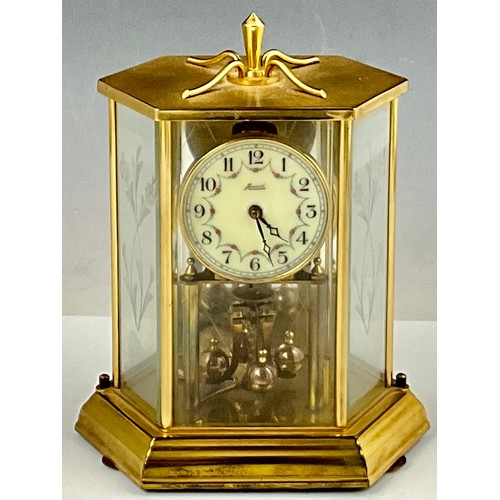 299 - VINTAGE ANNUAL BRASS & GLASS CASED TORSION CLOCK