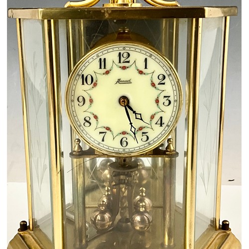 299 - VINTAGE ANNUAL BRASS & GLASS CASED TORSION CLOCK